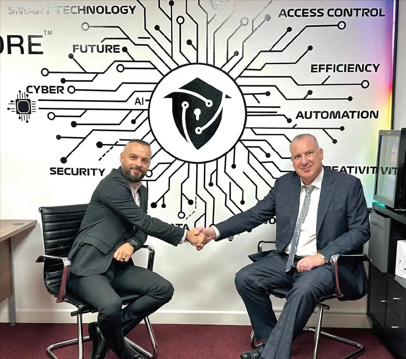 Marius, owner of Smart AI Core, shaking hands with Michael Nobes, Managing Director of Richmond Motor Group